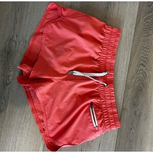 Vuori Women's Bright Coral Athletic Shorts